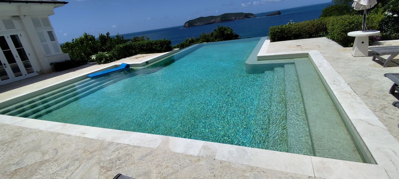 Large infinity pool with stone deck