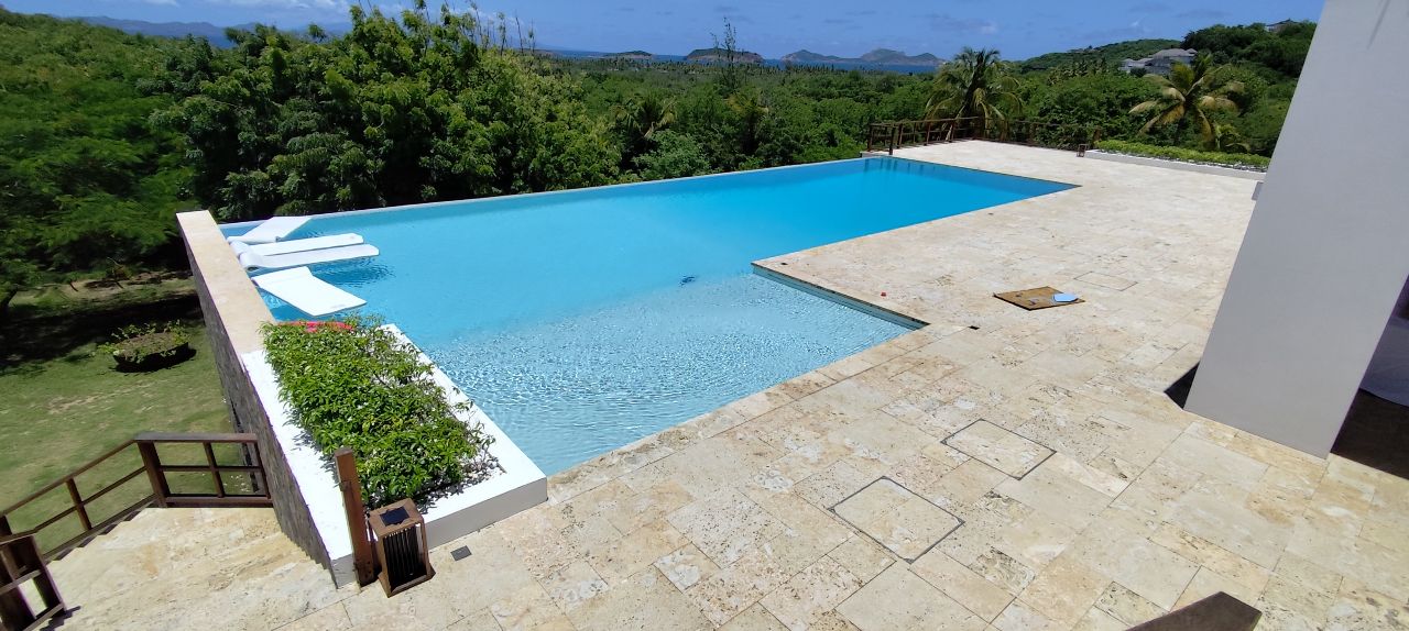 Large infinity pool with stone deck